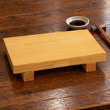 Empty 104027-C wooden sushi geta on a wooden dining table