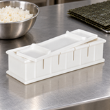 Assembled 154085 white plastic sushi mold and press on a stainless prep counter