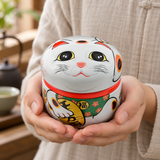 18SC1W white lucky cat tea container cradled in hands