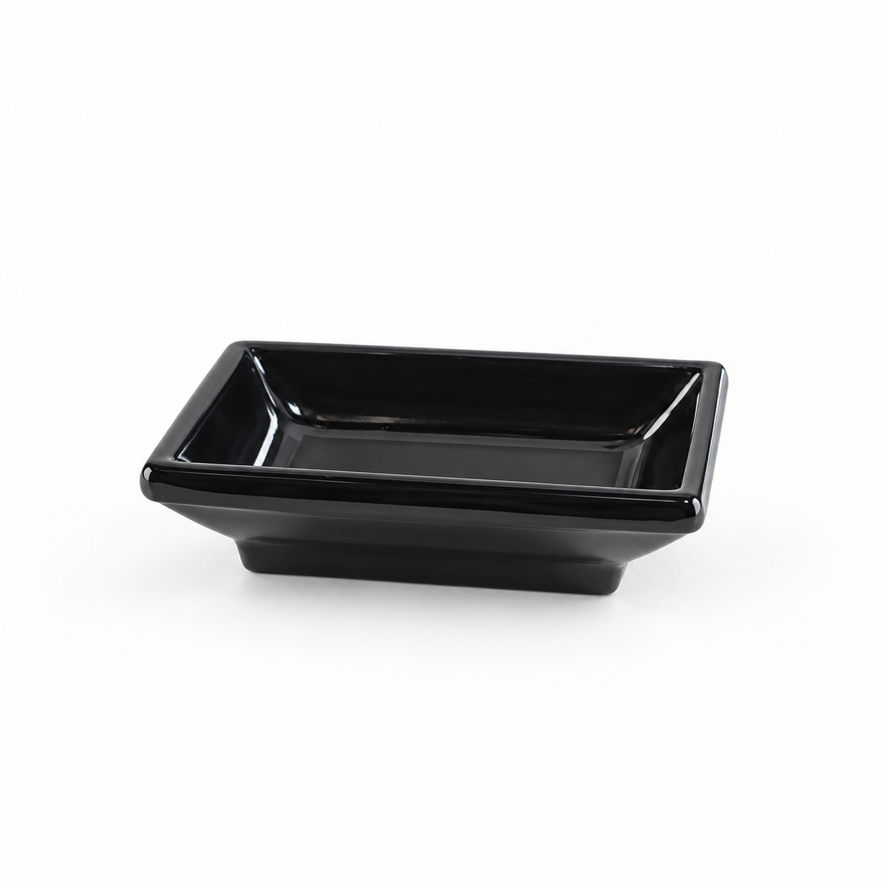 Melamine Rectangular Sauce Dish 3-3/4"x2-1/2", Black. Angled product view.