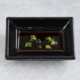 Melamine Rectangular Sauce Dish 3-3/4"x2-1/2", Black. Serving suggestion.