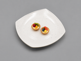 White speckled 236653 square plate with two petite fruit tartlets