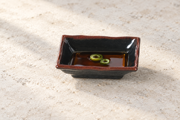 4" Melamine Rectangular Wave Sauce Dish, Tenmoku. Serving suggestion.