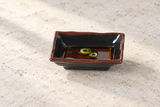 4" Melamine Rectangular Wave Sauce Dish, Tenmoku. Serving suggestion.