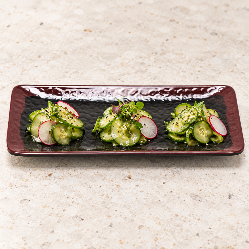 2411TM Tenmoku rectangular plate with three small cucumber appetizers.