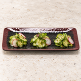 2411TM Tenmoku rectangular plate with three small cucumber appetizers.