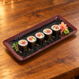 2411TM 11¼-inch Tenmoku plate with five small maki pieces.