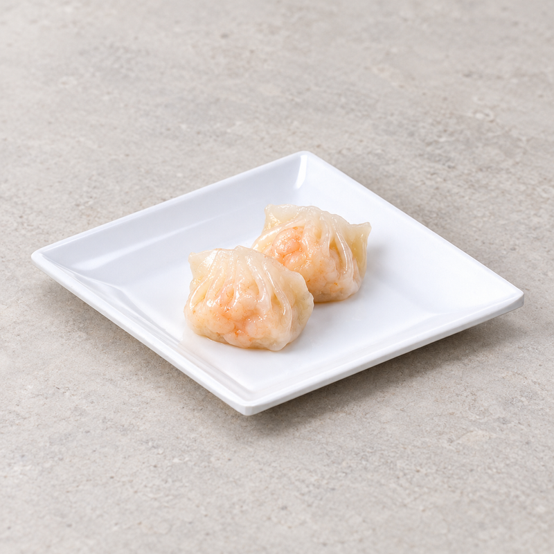 Two shrimp dumplings centered on the 29004WT white square flare plate on a neutral tabletop.