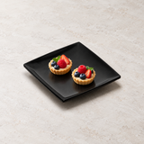 29007BK black melamine plate with two petite tartlets. Serving suggestion.