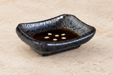 JX-235-B: 3.25"X2.25" Porcelain Rectangular Sauce Dish, Black Oribe. Restaurant serving context