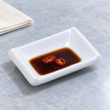 Melamine Rectangular Sauce Dish 3-5/8"x2-1/2", White. Serving suggestion.