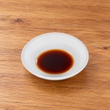326-W white melamine sauce dish with a shallow soy sauce serving