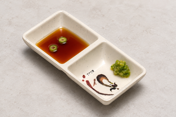 333-E: Melamine Rectangular Twin Sauce Dish 5.75"x2.75", Eggplant. Restaurant serving context