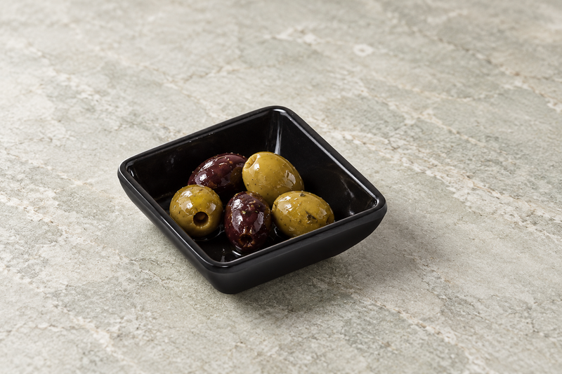334-AB black square dish holding green and dark olives with a little seasoned liquid.