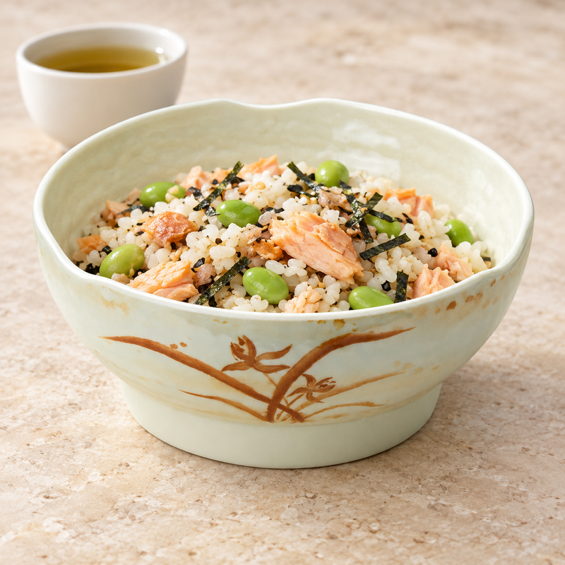 Gold Orchid bowl filled with rice, flaked salmon, edamame and nori.