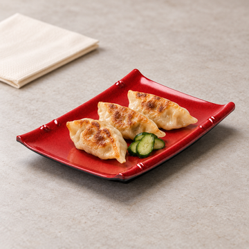 Melamine Rectangular Plate 6-5/8"x4-1/2", Black/Red. Serving suggestion.