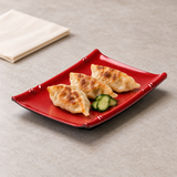 Melamine Rectangular Plate 6-5/8"x4-1/2", Black/Red. Serving suggestion.