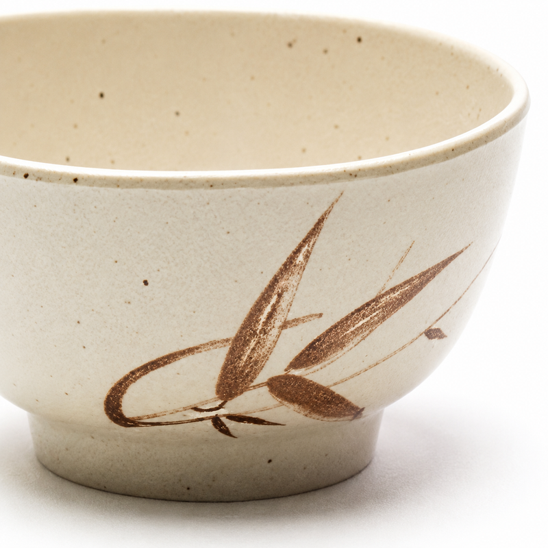 Detail of the brown leaf motif, beige speckling and short foot on the Autumn Grass bowl.