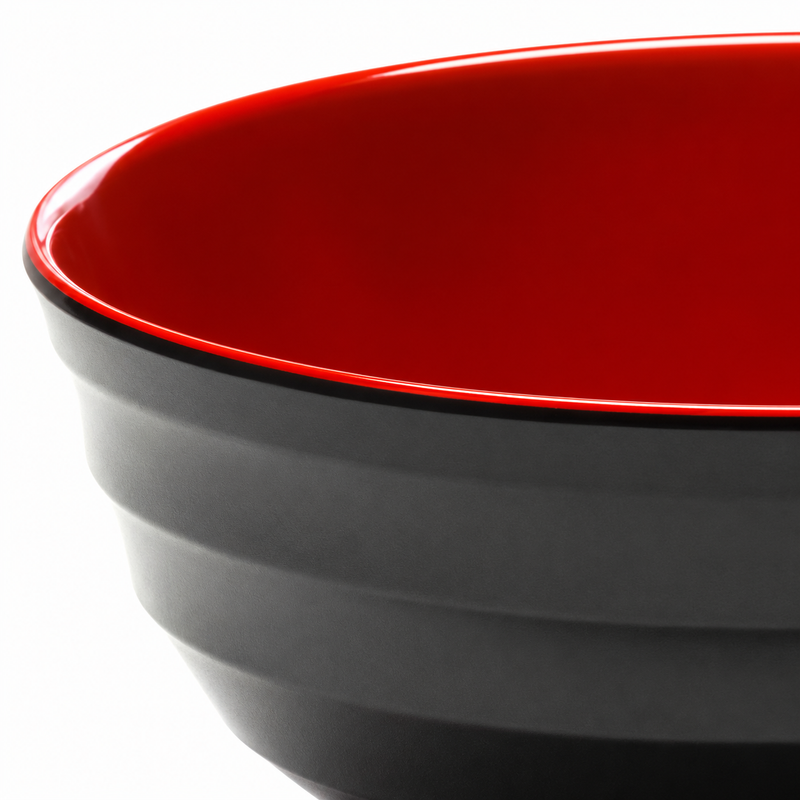 Close-up of the broad exterior bands and red rim on the black melamine bowl.