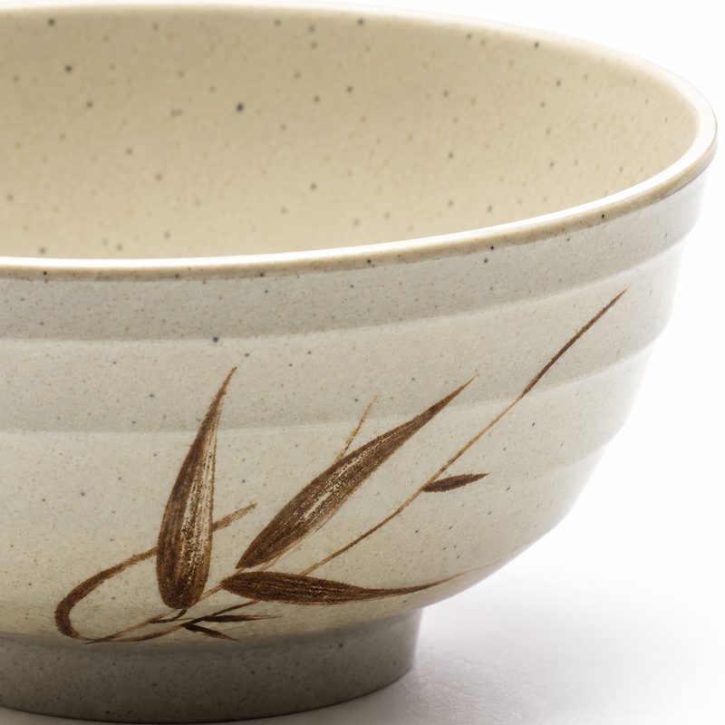 Close-up of the stepped rim, brown leaf motif and foot on the Autumn Grass bowl.