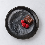 7"D x 5/8"H ROUND PLATE black/gold Meteorite Gold — styled view presentation