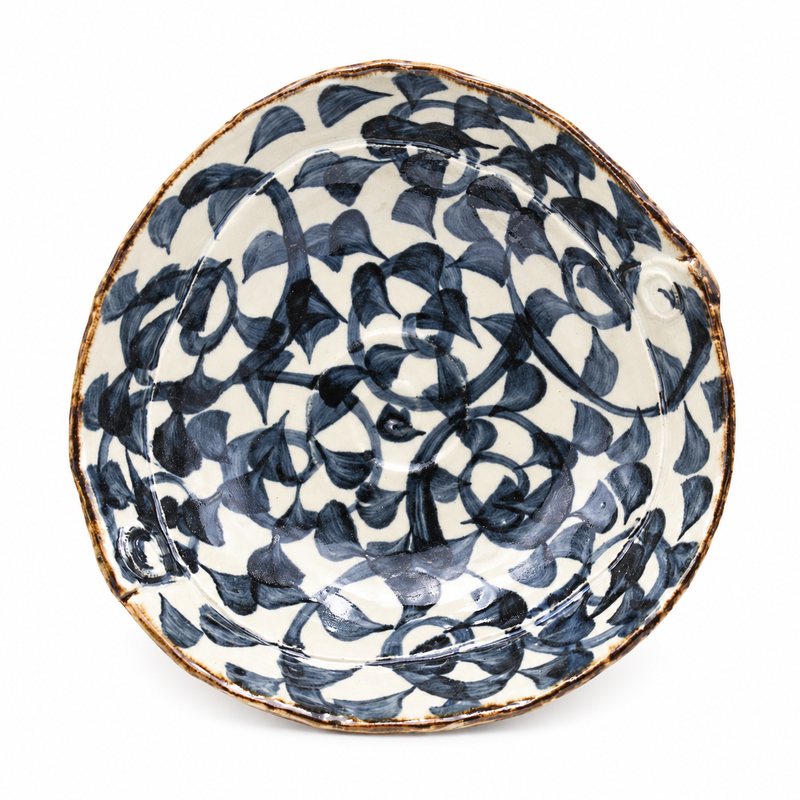 88274 ceramic serving bowl with navy vines and leaves across a cream interior
