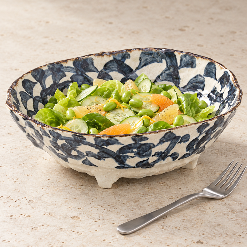 88274 navy-and-cream serving bowl filled with a green and citrus salad