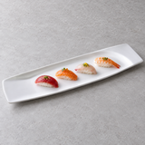 A14890 white ceramic rectangular platter with four modest nigiri portions