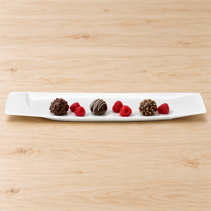 A14945 white rectangular platter with chocolate truffles and raspberries, low frontal view