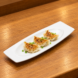 A15057 white serving plate with a modest food serving