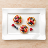A15416 white ceramic wave-edge rectangular plate with fruit tartlets