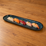 16" × 5.25" Obsidian Ceramic Serving Platter with a restaurant serving