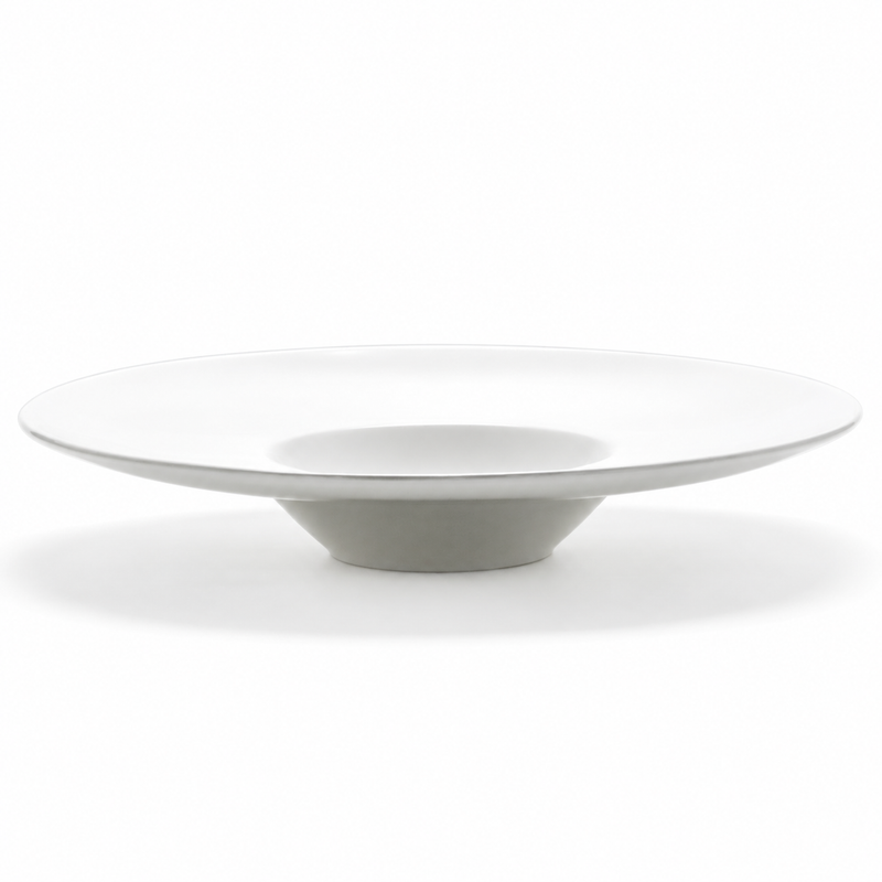 Side profile of the A2807 white ceramic plate showing the broad low rim and projecting recessed center.