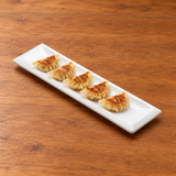 A6293 white framed rectangular plate with dumplings