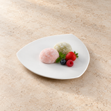 A7611 white ceramic triangular plate with a small dessert presentation on a restaurant tabletop; food not included.