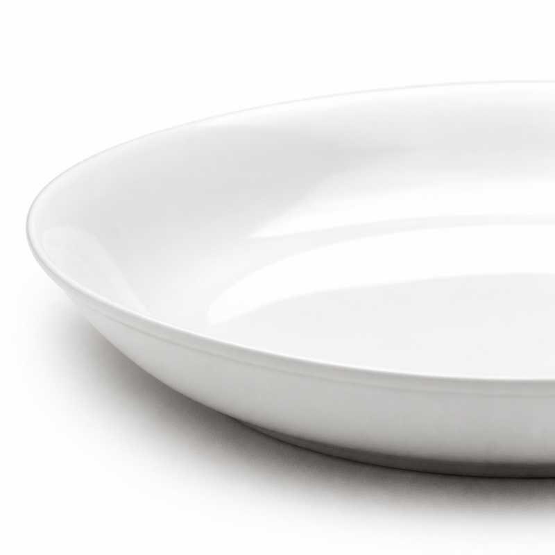 Detail of the gently curved white wall and simple round rim of the A7621 shallow bowl.