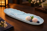 AS213-PL pale-blue plum-blossom scalloped platter with two petite mochi and blueberries, serving suggestion