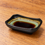 3½ × 2½ in Emerald Green Porcelain Sauce Dish in a serving setting