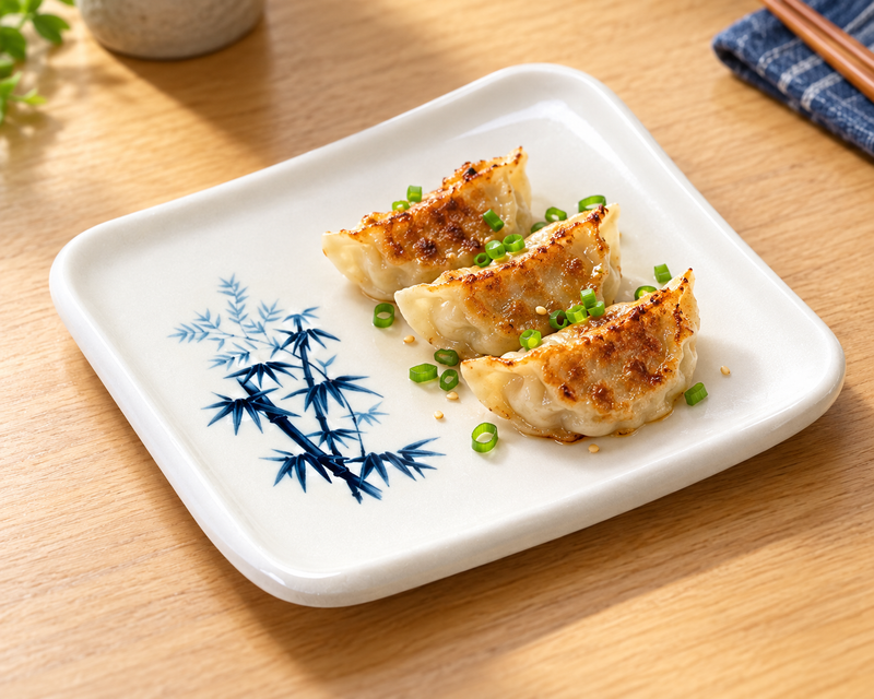 Dumplings on a blue bamboo melamine rectangular side plate