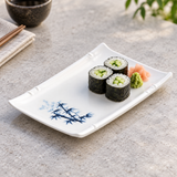 Cucumber sushi rolls on the blue bamboo melamine rectangular plate