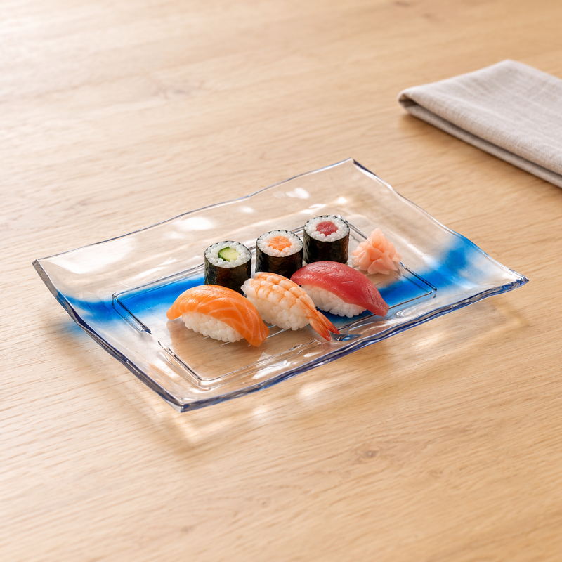Clear blue-streak plastic platter with three nigiri and three maki on a wood table
