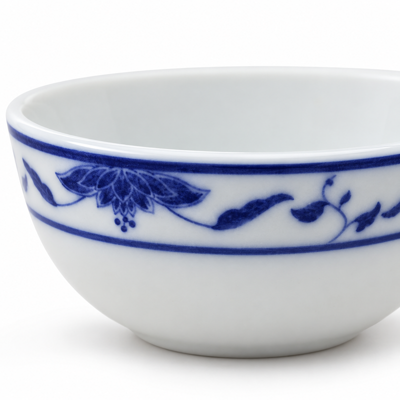 Close-up of the cobalt floral border on the compact Blue Lotus porcelain bowl.