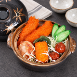 D6-ML maple-pattern ceramic donabe with a plated meal and its lid alongside