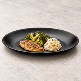 YG-812MB: Melamine Round Plate 12.5”, Matte Black. Restaurant serving context