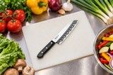 F-2133 knife on a preparation board with vegetables