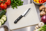 F-2174 knife on a preparation board with vegetables