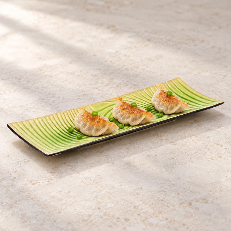 D2145-E green wave-pattern ceramic plate styled with three dumplings