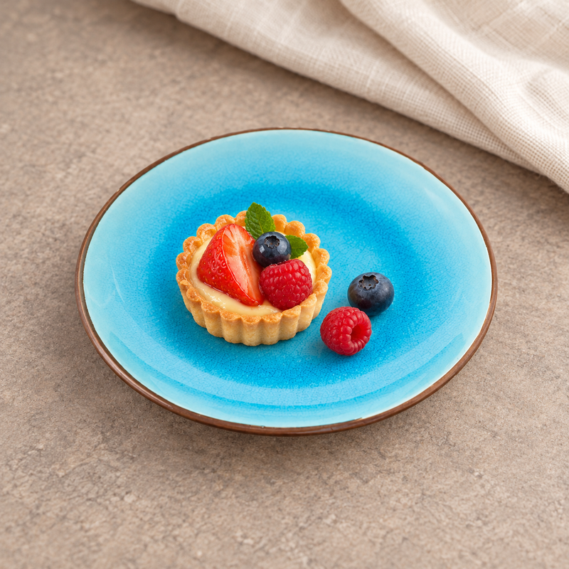 FB182 turquoise round plate with a fruit tart