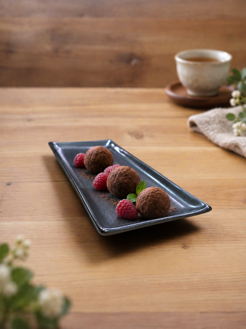 G5928-TK black porcelain plate with chocolate truffles and raspberries