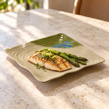 Grilled fish and asparagus on the 11-inch beige and green wavy square melamine plate